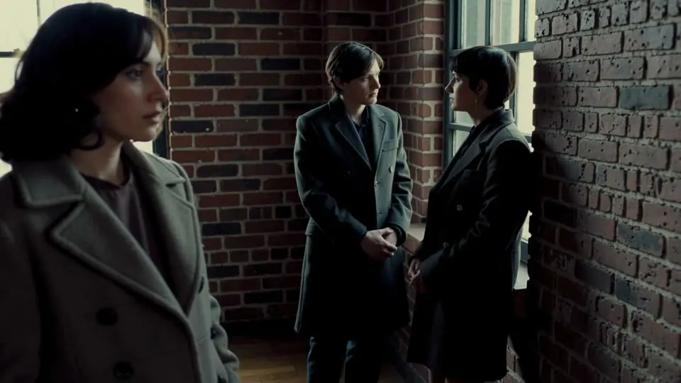 Three-Shot: Three people share the frame and the arrangement carries the relationship.