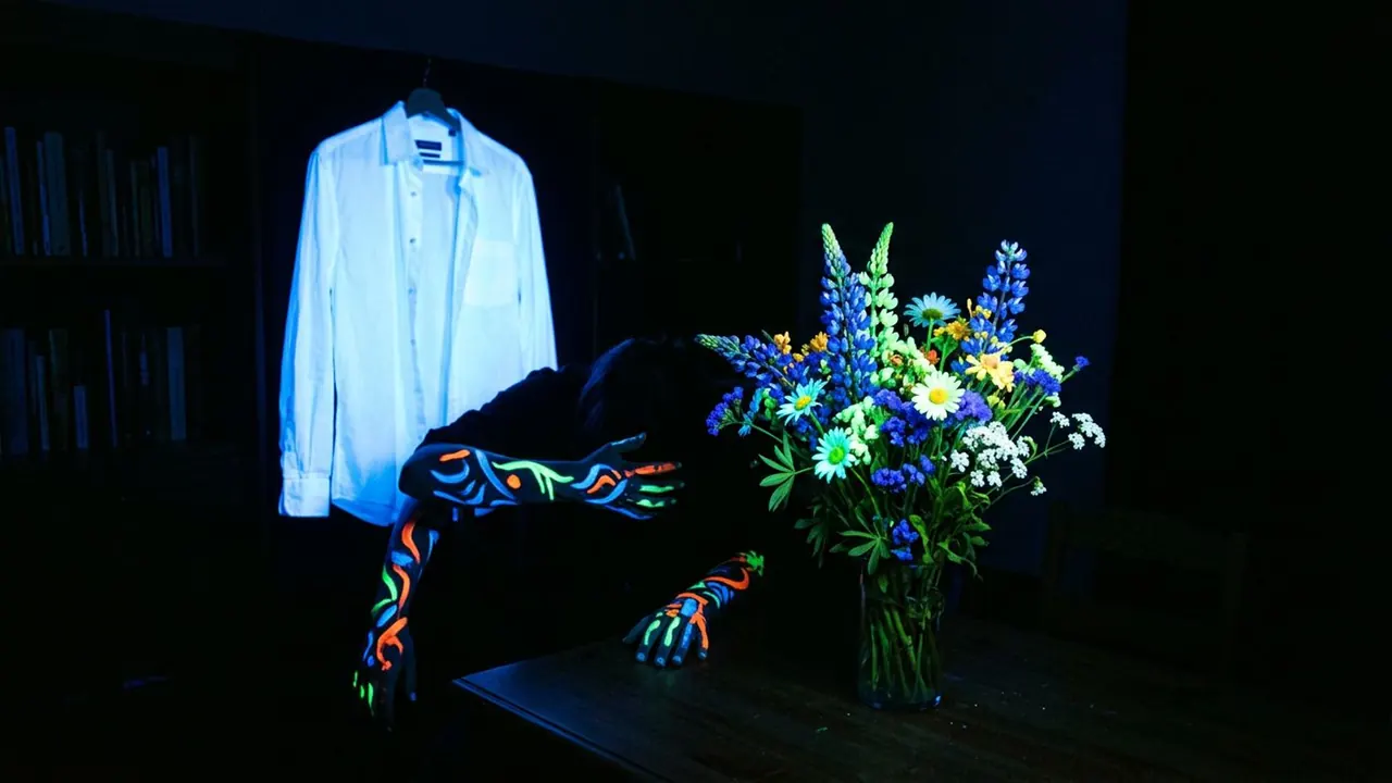 Ultraviolet: UV light makes whites and pigments glow against near black.