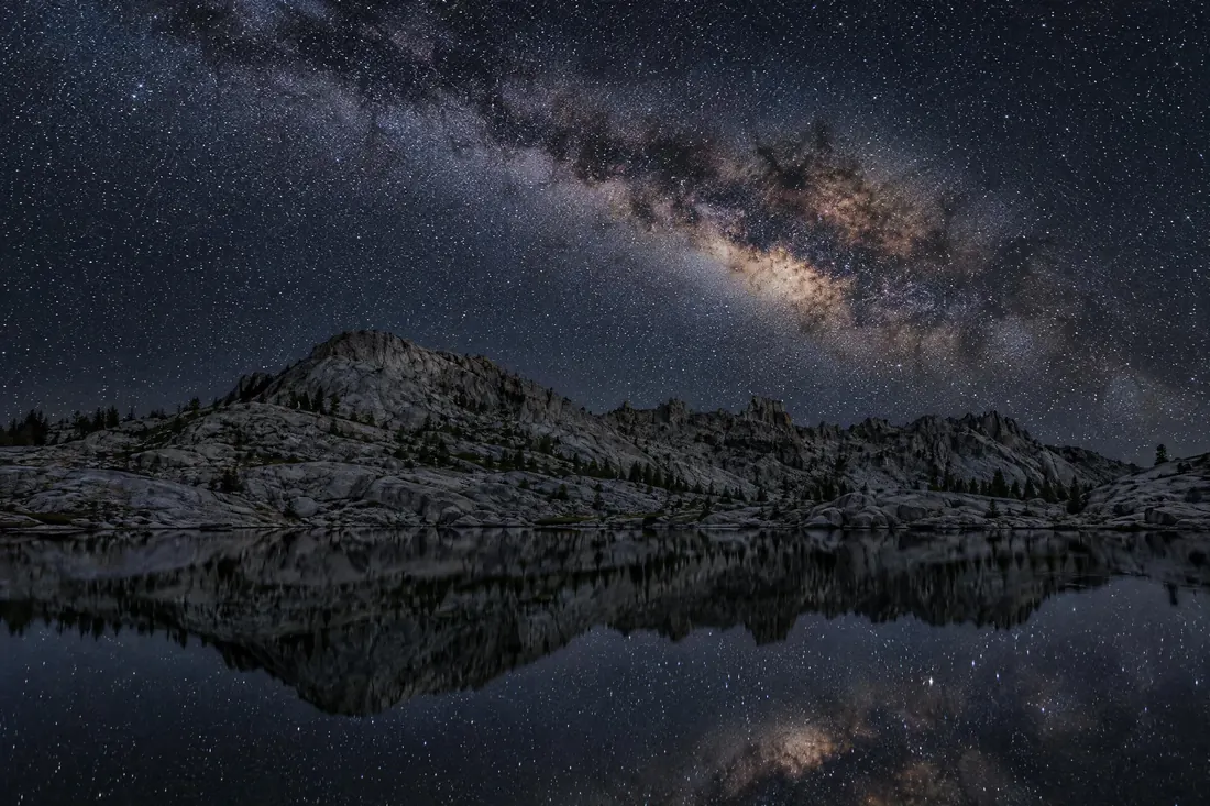 Astrophotography: A fast wide lens on a tripod, a high ISO, and an exposure long enough to record stars.