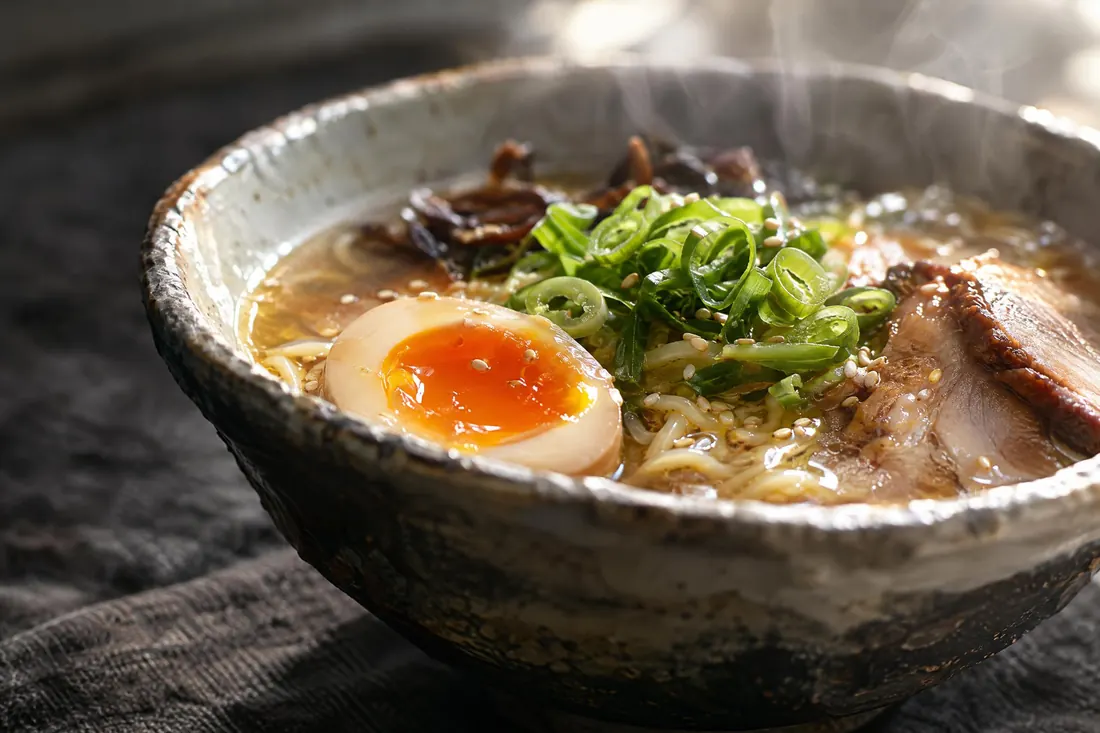 Food photography: Soft back light for steam and gloss, a 45 degree camera, and a plate built rather than cooked.